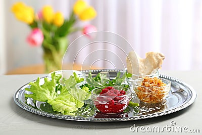 Traditional Passover Pesach Seder plate with symbolic meal on table, space for text Stock Photo