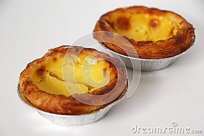 Traditional Portuguese custard pastry called a pasteis de nata isolated on white background Stock Photo
