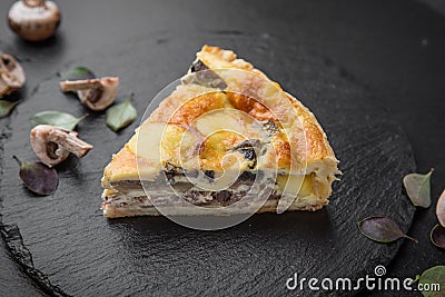Traditional quiche pie with mushrooms, chicken and cheese Stock Photo
