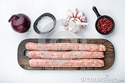 Traditional raw sausages, flat lay, on white background Stock Photo