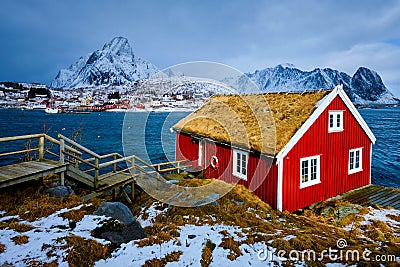 Traditional red rorbu house in Reine village on Lofoten Islands, Stock Photo