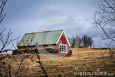 A traditional, red wooden icelandic house in Arbaersafn, Reykjavik, Iceland. Editorial Stock Photo
