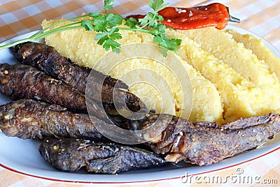 Traditional Romanian meal: mamaliga with fish Stock Photo