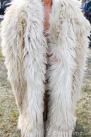 Traditional Romanian sheepskin coat for shepherd man during traditional country fair Stock Photo