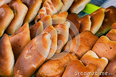 Traditional Russian baked pies close-up. Fresh mince pies. Stock Photo