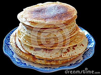 Traditional russian blini isolated on a black background. Pancakes. Pancake week. Maslenitsa Stock Photo