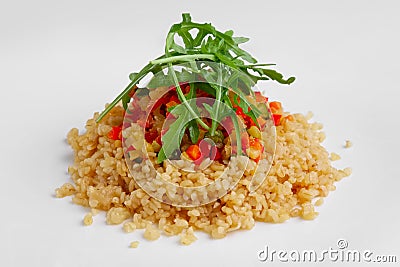 Traditional russian lenten salad with pearl barley, tomato, marrow squash, corn, zucchini and paprika Stock Photo