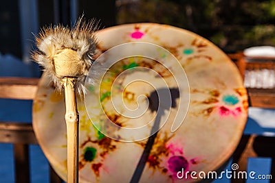 Traditional sacred drum and drumstick Stock Photo