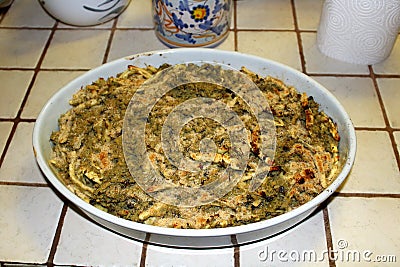 A traditional Sicilian spaghetti dish called `spaghetti con broccoli arriminati` composed of cauliflower, pine nuts, raisins and t Stock Photo