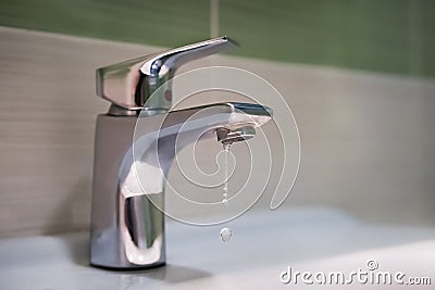 Traditional silver tap dripping Stock Photo