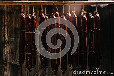 Traditional smokehouse. Traditional food. Smoked sausages meat. Sausages smoke in a smokehouse. Long banner format Stock Photo