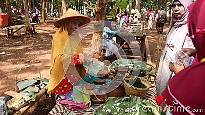 Traditional snack seller, in an old fashioned market, without using plastic wrap Editorial Stock Photo