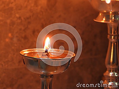 Traditional south indian brass oil lamp or Nilavilakku. During events like housewarming marriage etc. the Nilavilakku is lighted Stock Photo