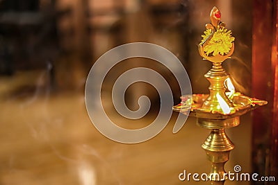 Traditional south indian brass oil lamp `Nilavilakku `. During events like housewarming, This picture is taken during a festival Stock Photo