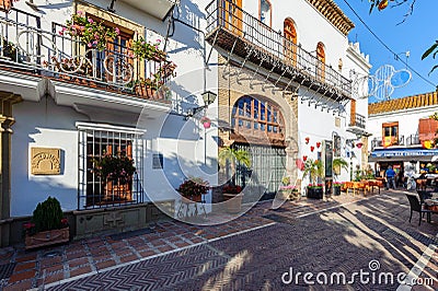 Traditional Spanish narrow street with souvenir shop and beautiful architecture in historical part of town Editorial Stock Photo