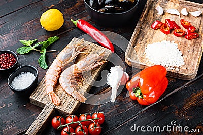 Traditional spanish seafood paella ingredients on old wooden dark table Stock Photo