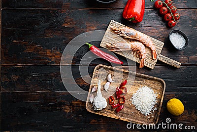 Traditional spanish seafood paella ingredients on old wooden dark table, top view with space for text Stock Photo