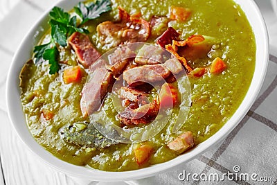 Traditional split pea soup on a white wooden table Stock Photo