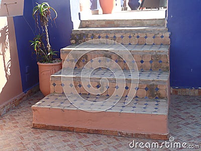 Traditional steps on a typical roof top terrace in Essaouira, Morocco Stock Photo