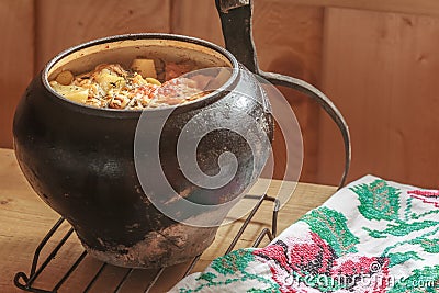 Traditional stew meal cooked in wood-fired oven Stock Photo