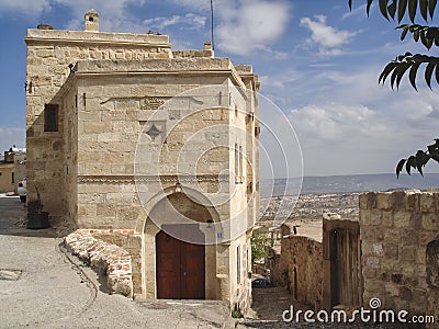 Traditional stone houses and narrow streets in the old town of Uchisar - famous tourist destination in Cappadocia, Turkey Stock Photo