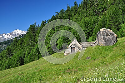 Traditional stone mountain architecture. Alpine house Stock Photo