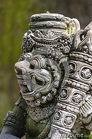 Traditional stone statue depicting demon, god and Balinese mythological deities in Ubud, island Bali, Indonesia , closeup Stock Photo