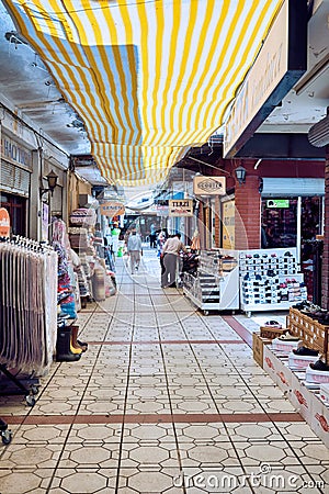 Traditional stores and people in historical malgaca square passage in Urla, Ä°zmir, Turkey Editorial Stock Photo
