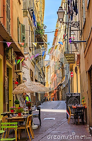 Traditional stores and quaint little restaurants in the old houses on narrow streets Old Town Vielle Ville Nice, France Editorial Stock Photo