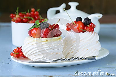 Traditional summer dessert pavlova with berries Stock Photo