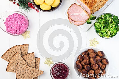 Traditional swedish and scandinavian Christmas table with baked ham in mustard crumble crust, beet salad, whole grane crackers, Stock Photo