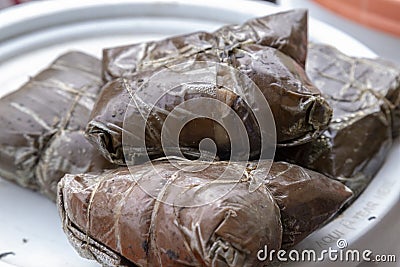 traditional tamales, wrapped in banana leaf valladolid, mexico Stock Photo