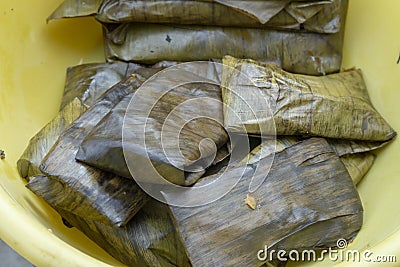 traditional tamales, wrapped in banana leaf valladolid, mexico Stock Photo