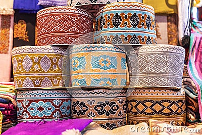 Traditional taqiyah hats for sale at the souk in Muttrah Stock Photo