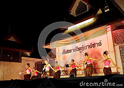 Traditional THAI dance greeting for market visitors on walking street, the CHIANG RAI NIGHT BAZAAR Editorial Stock Photo