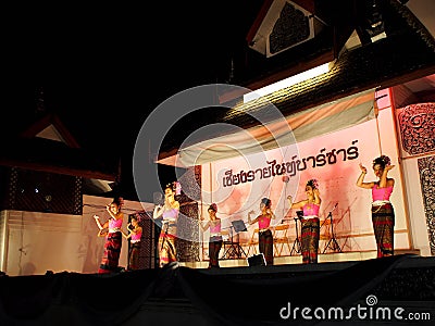 Traditional THAI dance greeting for market visitors on walking street, the CHIANG RAI NIGHT BAZAAR Editorial Stock Photo