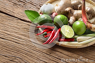 Traditional Thai food cuisine on Herb ingredient of Tom Yum spicy soup wood background Stock Photo