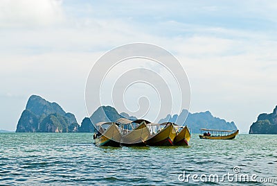 Traditional Thai tourist wooden boats parking Stock Photo