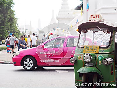 Traditional three-wheels THAI open air fun and well known BANGKOK and urban taxi Editorial Stock Photo