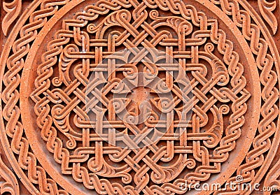 Traditional tufa stone carving ornament on a wall of Armenian Orthodox Church Stock Photo