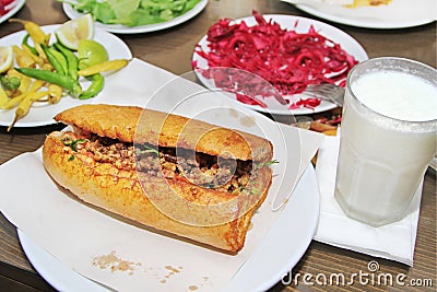 Traditional Turkish cuisine, Tantuni with loaf bread. Stock Photo