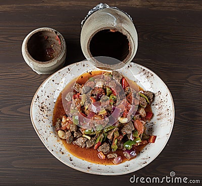 Traditional turkish cuisine. Testi kebab, local food in Turkey. Authentic Turkish Testi Kebab cooked in earthenware water jug Stock Photo