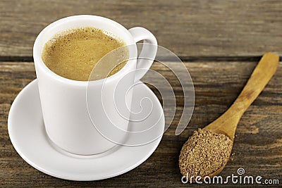 Traditional Turkish Dibek coffee in coffee cup on wooden table Stock Photo