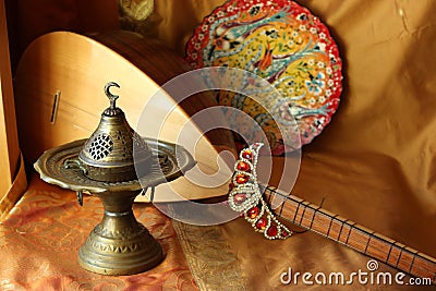 Traditional turkish lamps, national musical instrument baglama saz, handmade plate and crown jewelery. magnificent century. Stock Photo