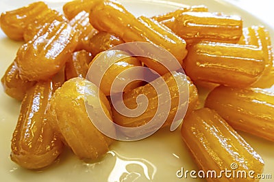 Traditional turkish tulumba dessert in white plate Stock Photo