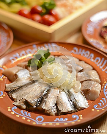 Traditional Ukrainian food herring fish, side view, horizontal. Served on a rustic wooden table Stock Photo