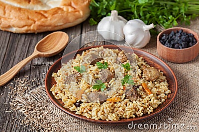 Traditional uzbek meal pilaf. Rice with meat Stock Photo