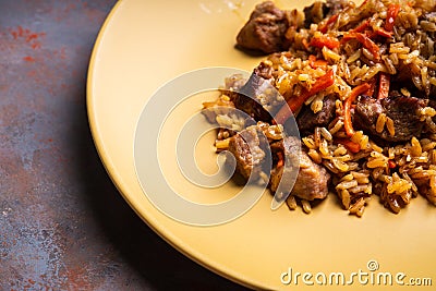 Traditional Uzbekistan pilaf on the rustic background Stock Photo