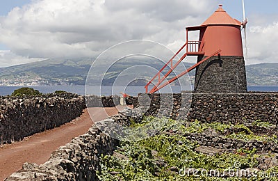 Traditional vineyard plantation windmill in Pico island. Azores. Stock Photo