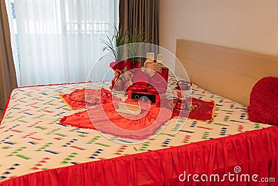 Traditional wedding ceremony decoration. Chinese dowry Marriage on bed. money and rings for Thai Engagement Stock Photo